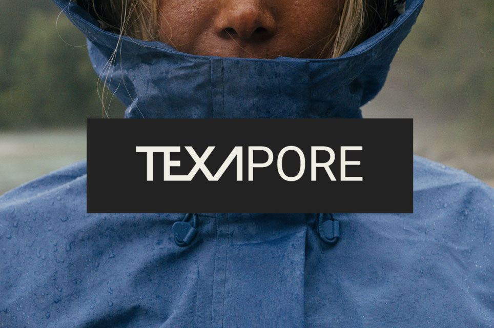 Close-up of a woman in the rain wearing a rain jacket